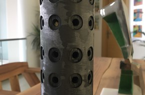 carbon tube for folio machine with holes for pneumatic holder units